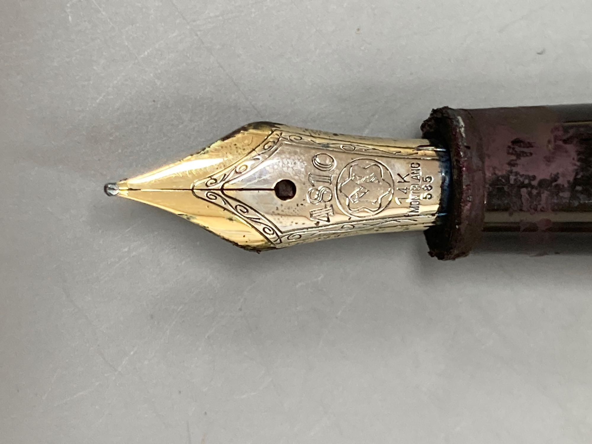 A Mont Blanc fountain pen and a belt